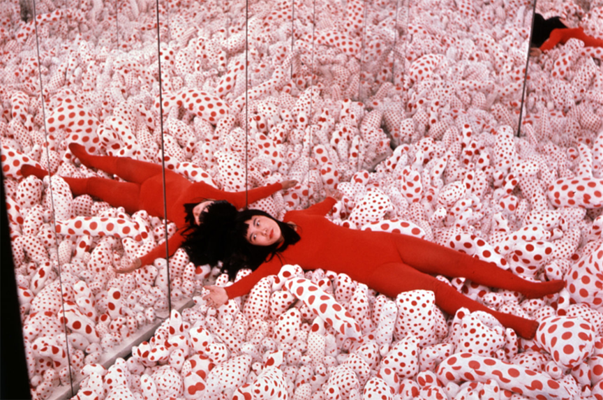 Yayoi shown here in her installation: Phalli's field 1965